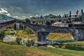 Three archs medieval humpback bridge in Italy